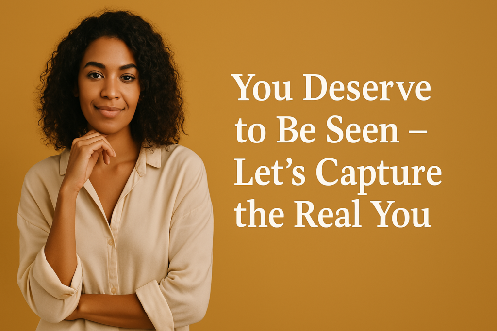 Confident woman with curly hair wearing a beige shirt standing against a mustard yellow background, with bold white text beside her that reads "You Deserve to Be Seen – Let’s Capture the Real You."