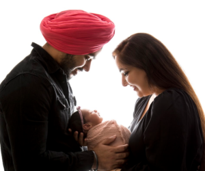 Parents holding their newborn baby