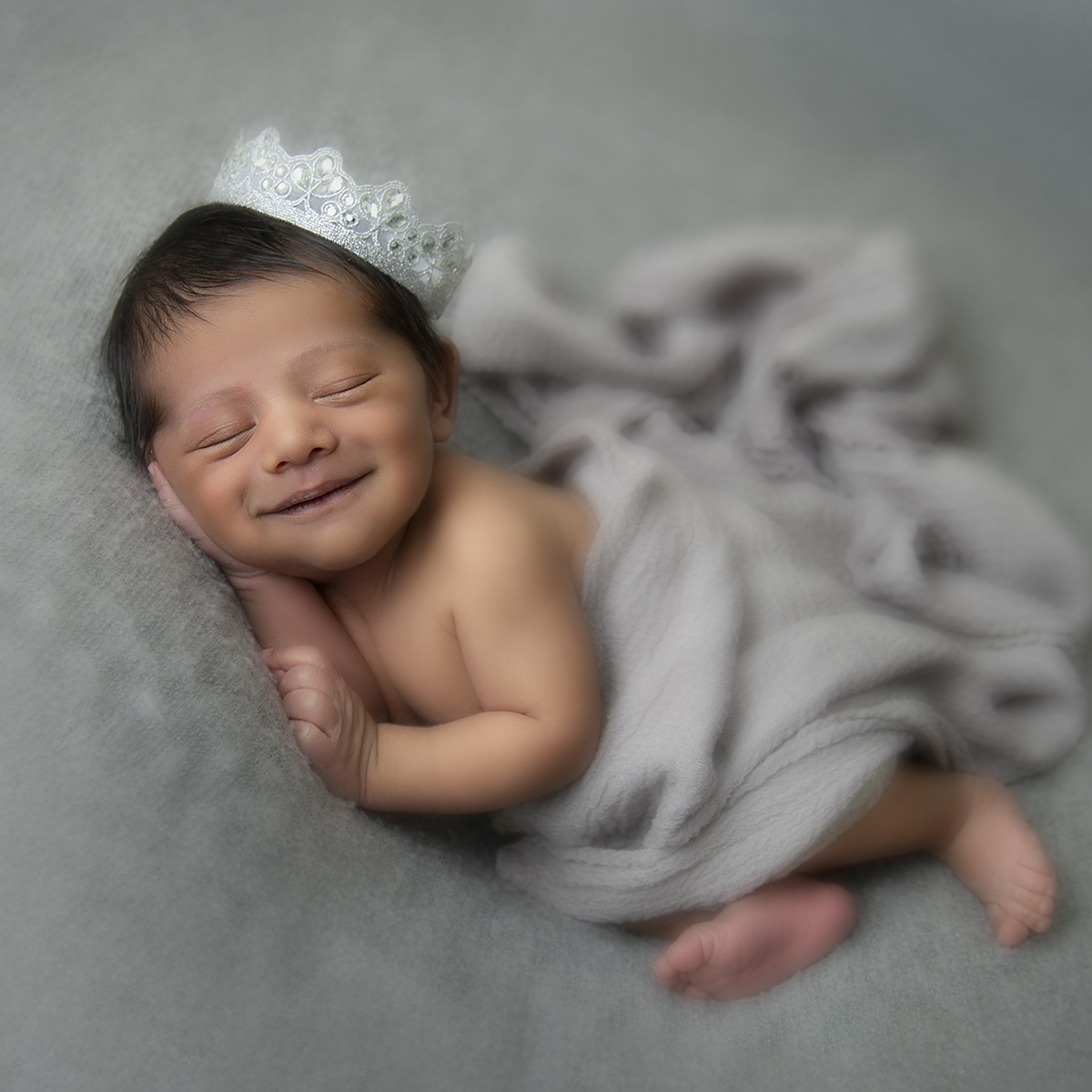 baby boy with crown newborn photography surrey client at artin photography studio