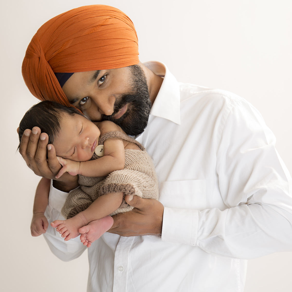 cradle pose newborn photography surrey client at artin photography studio
